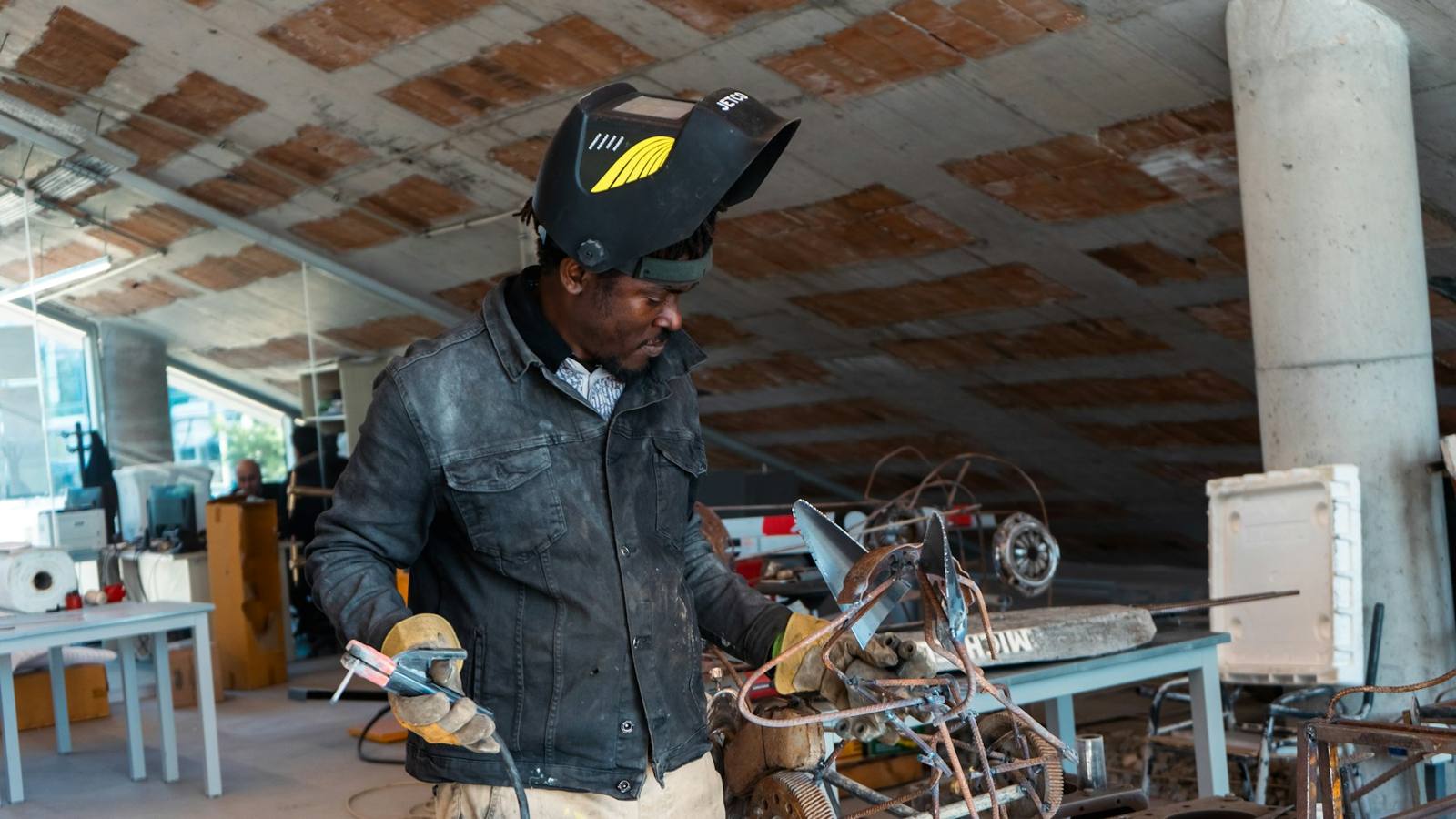 Technician working on an engine with a wrench